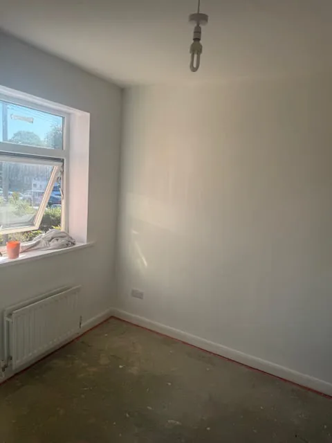 Bedroom with fresh paint and new skirting boards