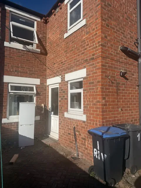 Rear of the brick terrace with a new back door and windows