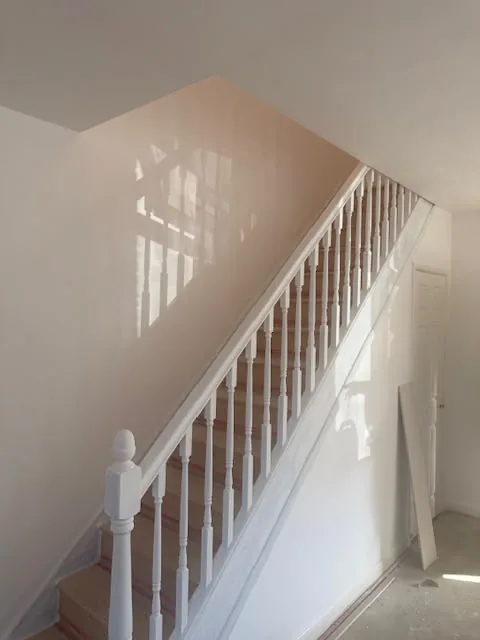Staircase with newly painted white spindles